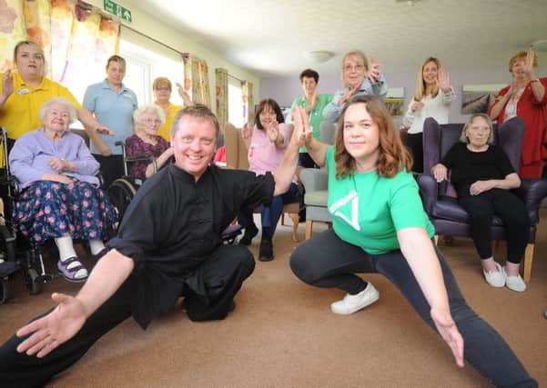Tai-Chi coach Ray Pawlett with sponsor Katie Dean with staff and residents at the launch of a Action for Elders scheme at Werrington Lodge care home, Baron Court EMN-190524-144741009