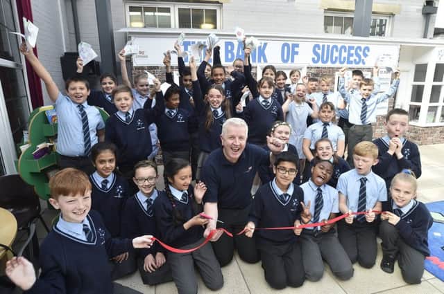 Pupils at the Discovery primary school at the opening of the school bank with sponsor Peter Melkowski of Print Solutions EMN-190520-222245009
