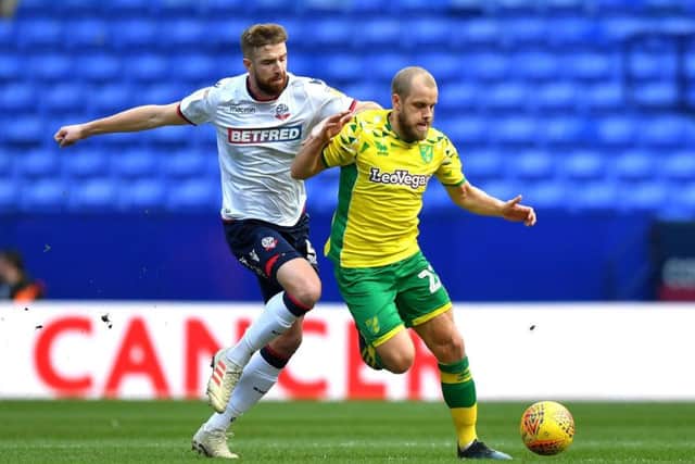 Mark Beevers (white) in action for Bolton against Norwich.
