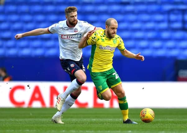 Mark Beevers (white) in action for Bolton against Norwich.