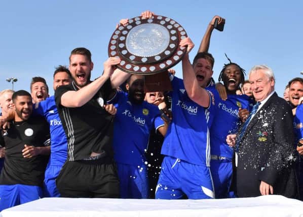 Peterborough Sports celebrate their Southern League title success.