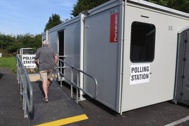 A polling station in the car park at House of Feasts in Eye