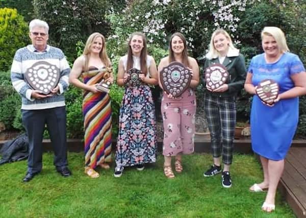 Peterboroughg Rugby Club Ladies team award winners. From the left are Bob Clarke, Sarah Winder, Nat Elliott, Steph Warlow, Krsten Swinscoe and Kaleigh Wheeler.