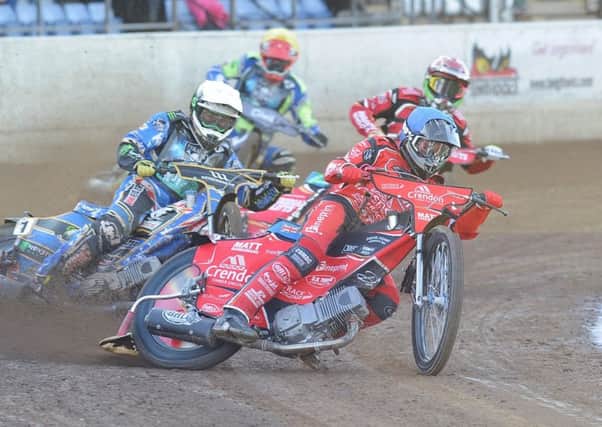 Heat one action from Panthers win over Poole with Bradley Wilson-Dean (blue helmet) and Hans Andersen in action for the city side. Photo: David Lowndes.