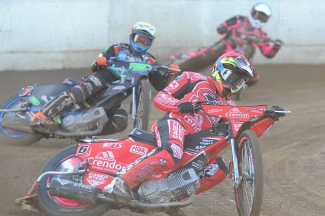 Charles Wright leads the way for Peterborough Panthers in heat three of the win over Poole Pirates. Photo: David Lowndes.