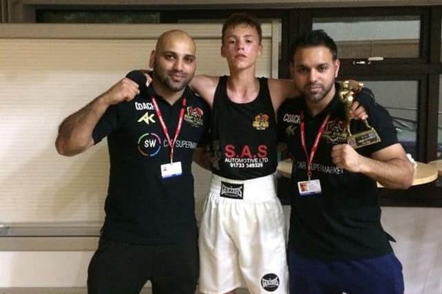 Freddie Brooks with coaches Hamad Javed (left) and Bilal Javed .