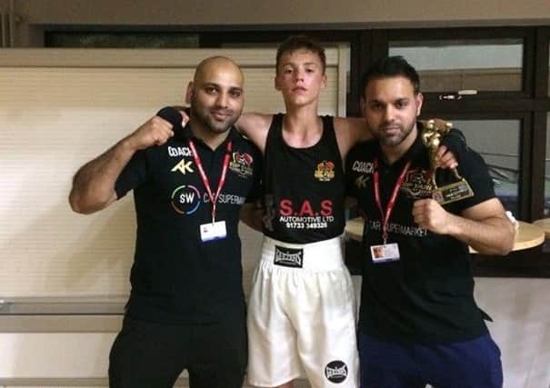 Freddie Brooks with coaches Hamad Javed (left) and Bilal Javed .