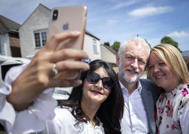 Labour leader Jeremy Corbyn has a selfie while campaigning with the party's prospective parliamentary candidate Lisa Forbes (right) and local councillor Shabina Qayyum (left) in Peterborough ahead of the upcoming by-election. Picture: Danny Lawson/PA Wire