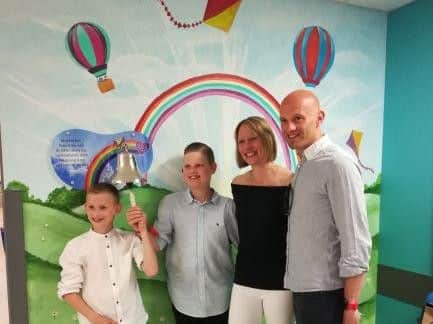 Isaac rings the bell with his family