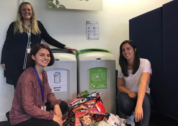 Lee Hitchborn, Julia Marques-Pike and Gabriella Brown with a weeks worth of crisp packets collected for recycling.