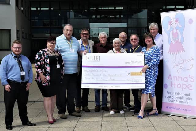 The TDET and model club cheque presentation to Anna's Hope.