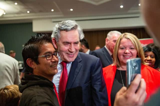 Gordon Brown meets a supporter alongside Lisa Forbes at the Holiday Inn. Photo: Terry Harris