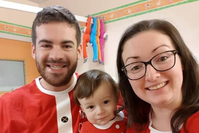 Alfie Webb, 1, with mum Saffron and dad Ollie Webb. Photo: SWNS