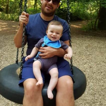 Alfie with dad Ollie. Photo: SWNS