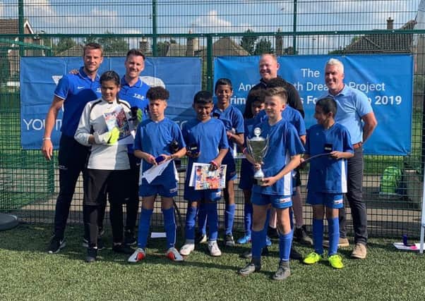 Cup winners St Thomas More are pictured with Youth Dreams Project directors Luke Steele and Luke Kennedy, sponsor Graham Fagan and Lincoln City chief scout Marc Tracy.