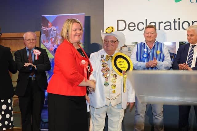 Lisa Forbes is congratulated on her victory by the Monster Raving Loony Party Alan 'Howling Laud' Hope
