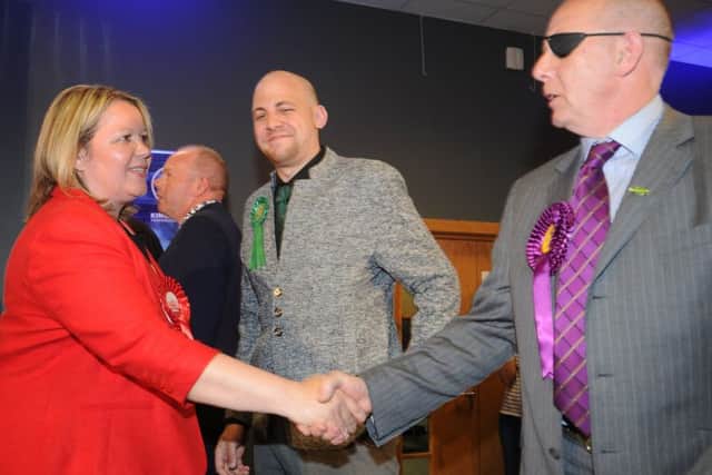 UKIP's John Whitby congratulates Labour's Lisa Forbes on her victory in the Peterborough by-election.