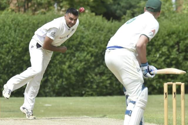 Ajaz Akhtar bowling for Barnack against Castor. Photo: David Lowndes.