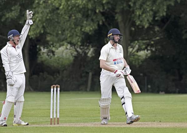 March Town wicket-keeper Andrew George successfully appeals for lbw in the narrow win over Thriplow. Photo: Pat Ringham.