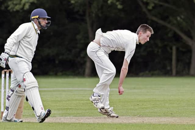 Sam Clarke during his spell of 4-25 for March against Thriplow. Photo: Pat Ringham.