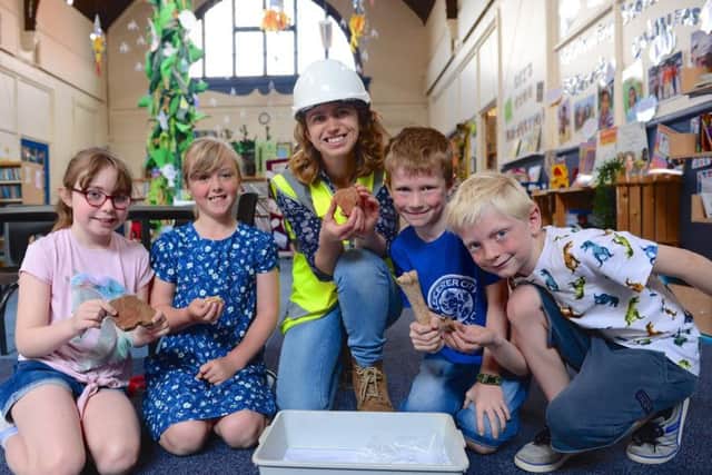 Ramsey Junior School pupils with Clemency Cooper from Oxford Archaeology East,