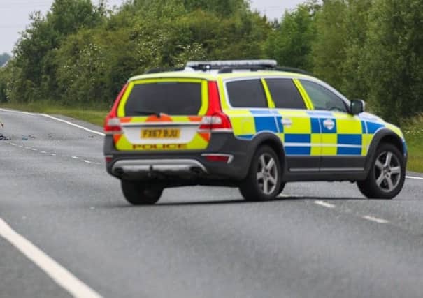 Police at the scene of the crash on the A16. Photo: Terry Harris