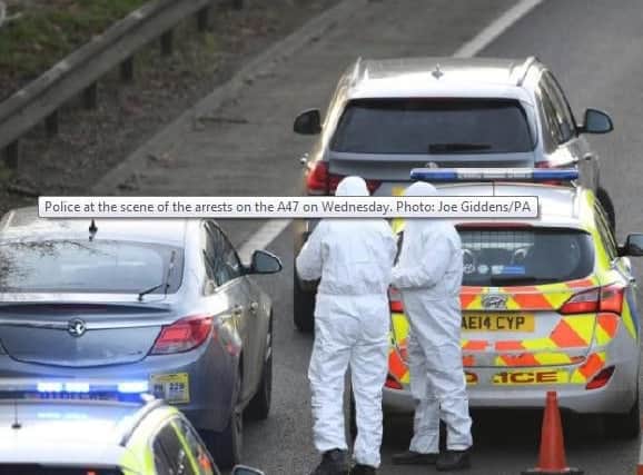 Police at the scene of the arrests on the A47. Photo: Joe Giddens/PA