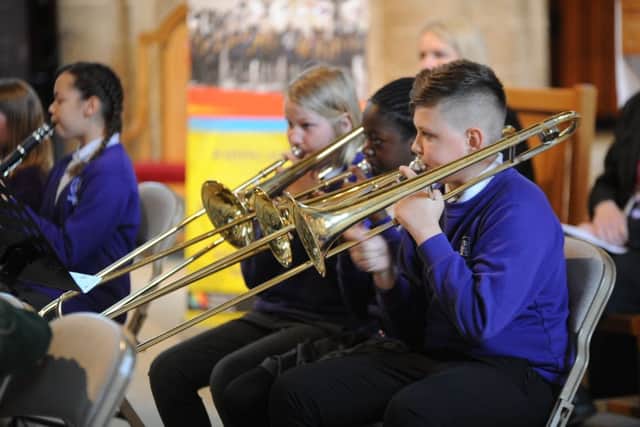 Woodston primary school musicians playing at the Children's University graduation ceremony at Peterborough Cathedral EMN-190613-175440009
