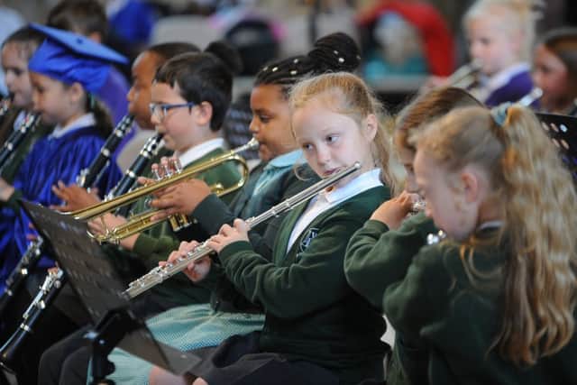 Woodston primary school musicians playing at the Children's University graduation ceremony at Peterborough Cathedral EMN-190613-175451009