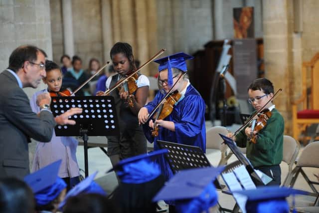 Woodston primary school musicians playing at the Children's University graduation ceremony at Peterborough Cathedral EMN-190613-175513009