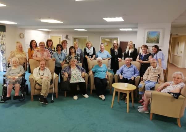 Residents and staff from the four Extra Care schemes after they raised hundreds of pounds during Dementia Awareness Week.