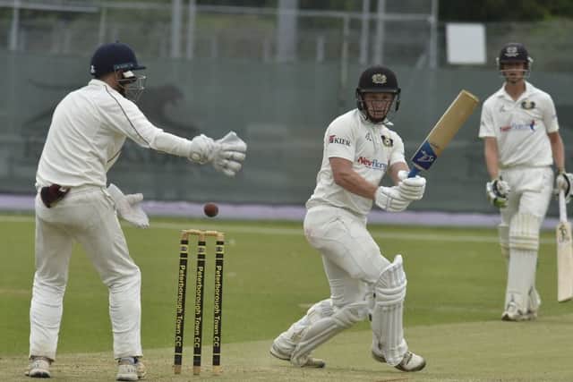 Alex Mitchell batting for Peterborough Town against March Town.