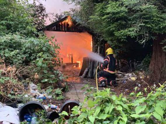 Firefighters tackling a recent shed fire at Ely House