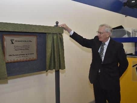 The Duke of Gloucester unveils a plaque marking the opening of the new production centre.