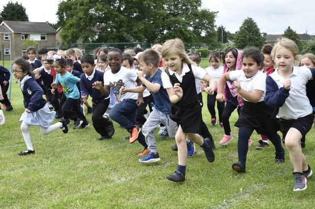 Longthorpe Primary School reception children starting a series of charity races at the school EMN-190618-223947009