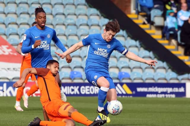 Alex Woodyard (blue) in action for Posh last season.