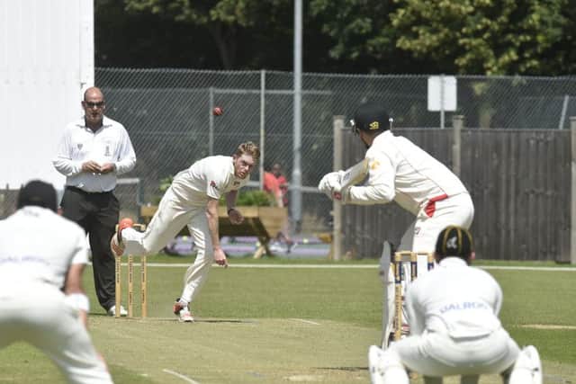 Mark Edwards bowling for Peterborough Town against Brigstock. Photo: David Lowndes.
