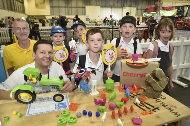 Schools Farming event at the East of England Arena. Paul Hodson and Paul Freakley of the Barclays Eagle Labs with pupils from Barnack C of E School. EMN-190107-144213009