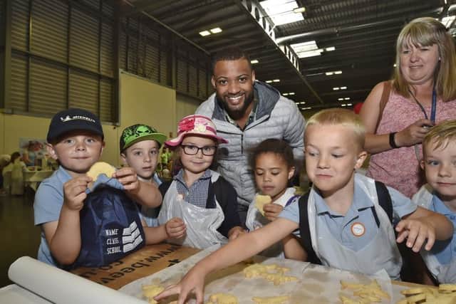 Schools Farming event at the East of England Arena.  J B Gill touring the  show with pupils from Cavalary School. EMN-190107-144344009