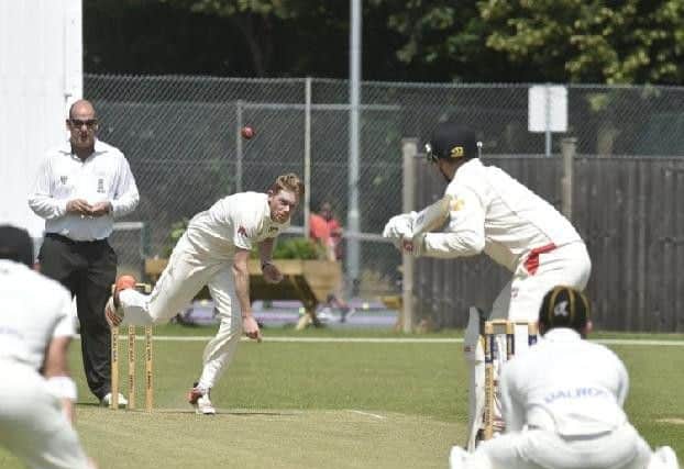Mark Edwards bowling for Peterborough Town against Brigstock. Photo: David Lowndes.