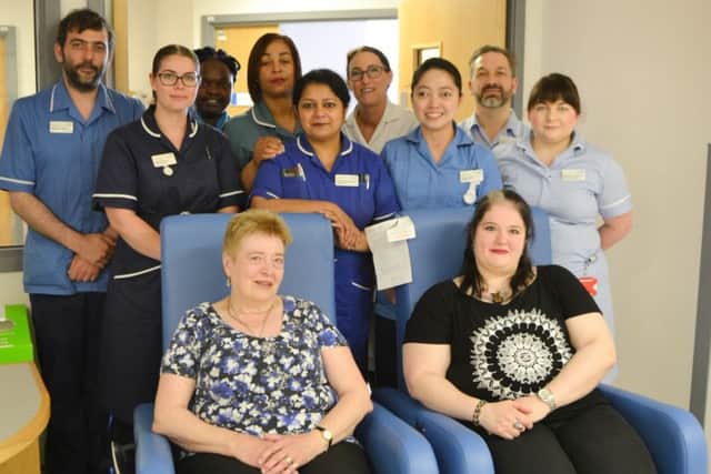Jan Haworth and daughter Anna Marie with staff from Ward A8.