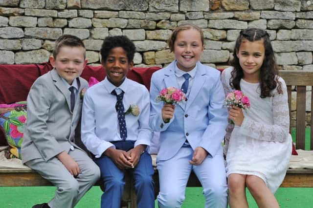Castor C of E primary school May Day celebrations . May Queen (light blue suit) Isla Wales, May King (white shirt) Jaden Edwards, attendants Alfie Marriott (grey suit) and Erica Johnson. EMN-190626-154959009