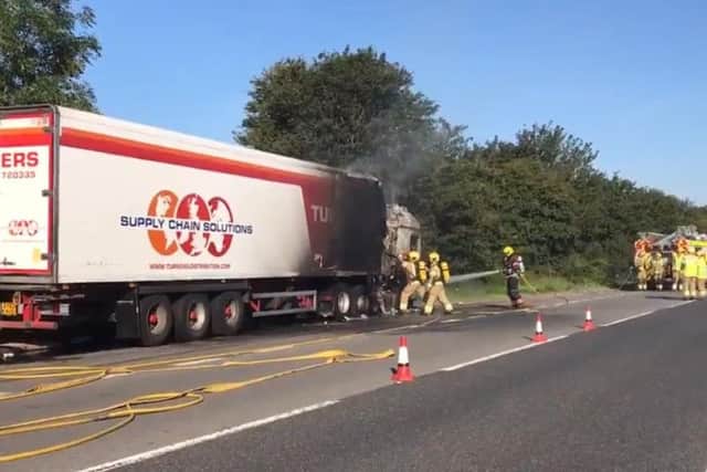 Fire crews tackling the lorry fire. Photo and video: BCH Road Policing Unit