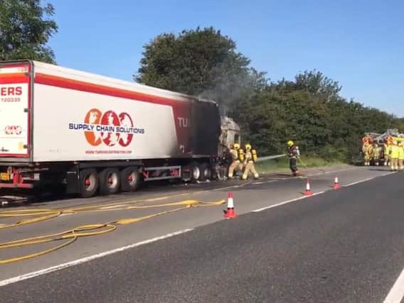 Fire crews tackling the lorry fire. Photo and video: BCH Road Policing Unit