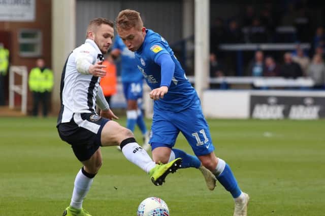 Louis Reed in action for Posh last season.