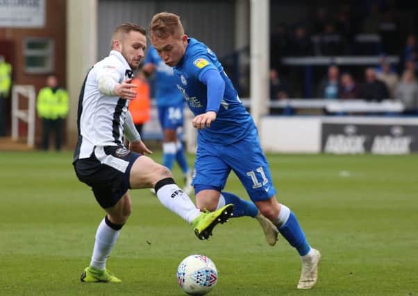 Louis Reed in action for Posh last season.