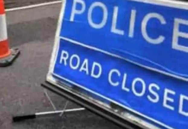 Police road closed sign