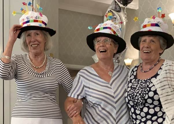 The triplets celebrate their 80th birthdays
