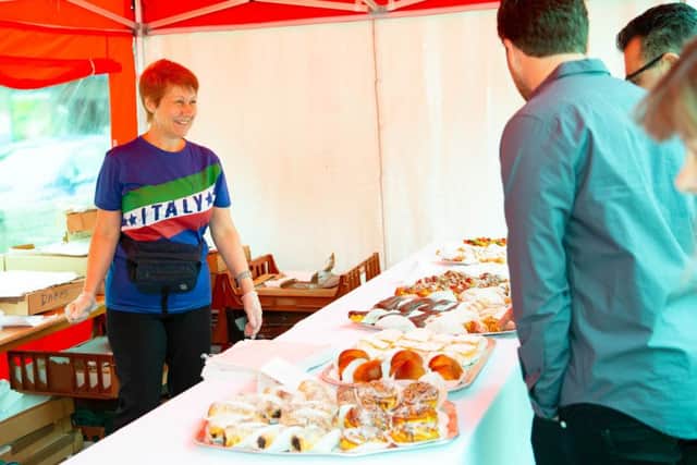 People buyng cakes at the italian festival,City Centre, Peterborough07/07/2019. Picture by Terry Harris / Peterborough Telegraph. THA