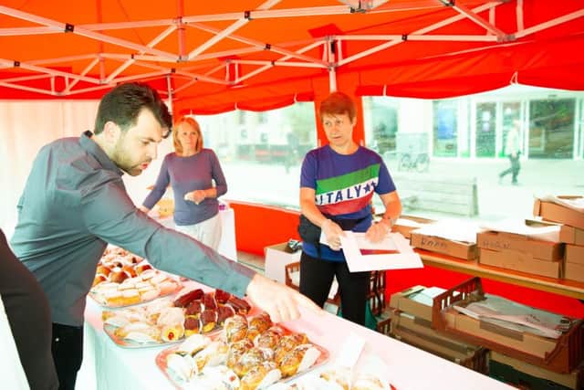 People buyng cakes at the italian festival,City Centre, Peterborough07/07/2019. Picture by Terry Harris / Peterborough Telegraph. THA